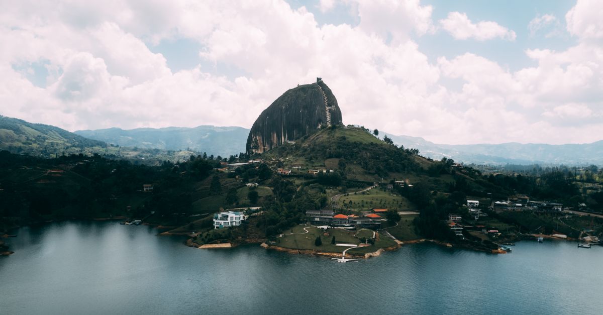 Stunning aerial view of the iconic El Peñol rock and surrounding landscape in Guatapé, Colombia.