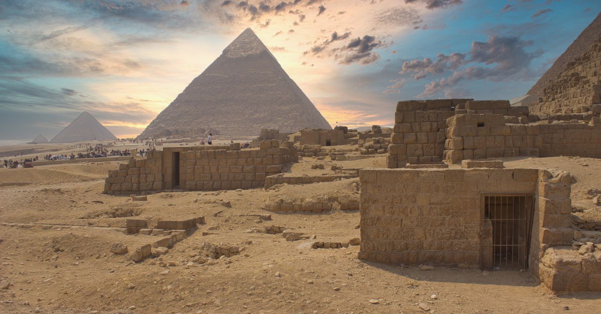 Captivating view of Giza Pyramids at sunrise in Cairo, showcasing ancient Egyptian architecture.