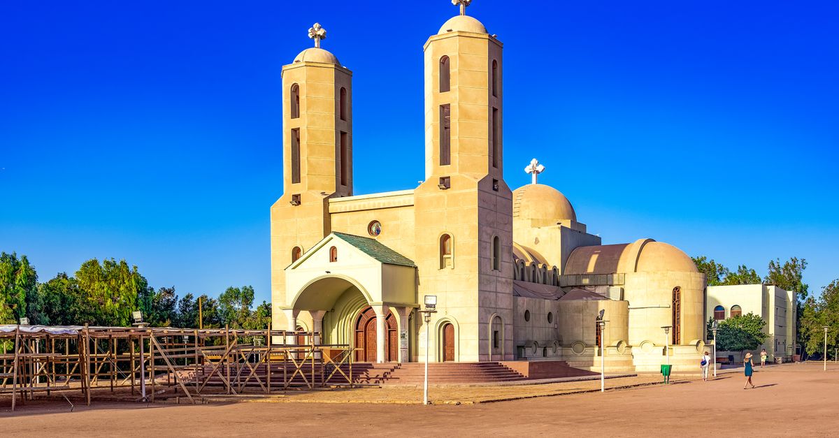 Ethiopian Orthodox church with distinct twin towers under a clear blue sky.