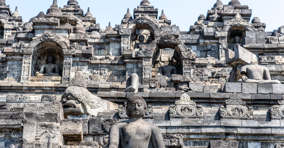 Close-up view of ancient stone sculptures and architecture at Borobudur Temple, Indonesia.