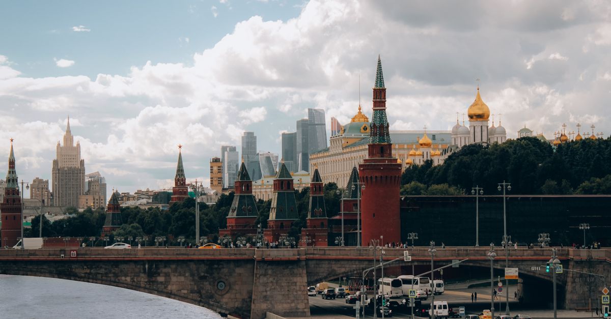 Capture of the Moscow Kremlin with a bridge over the Moscva River, vibrant skyline.
