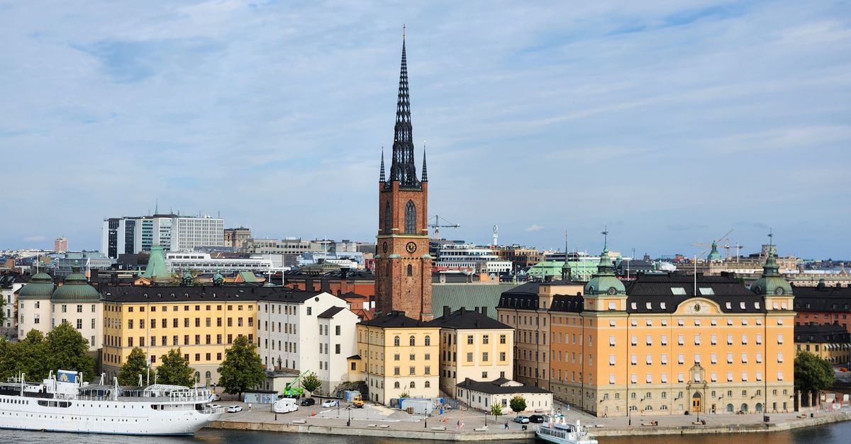 A stunning view of Riddarholmen Church and colorful buildings in Stockholm, Sweden.