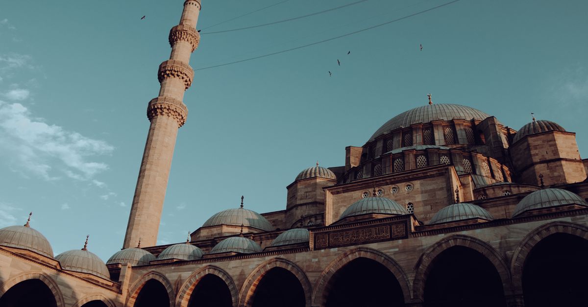 Captivating view of the Suleymaniye Mosque and minaret against a clear sky in Istanbul, Turkey.