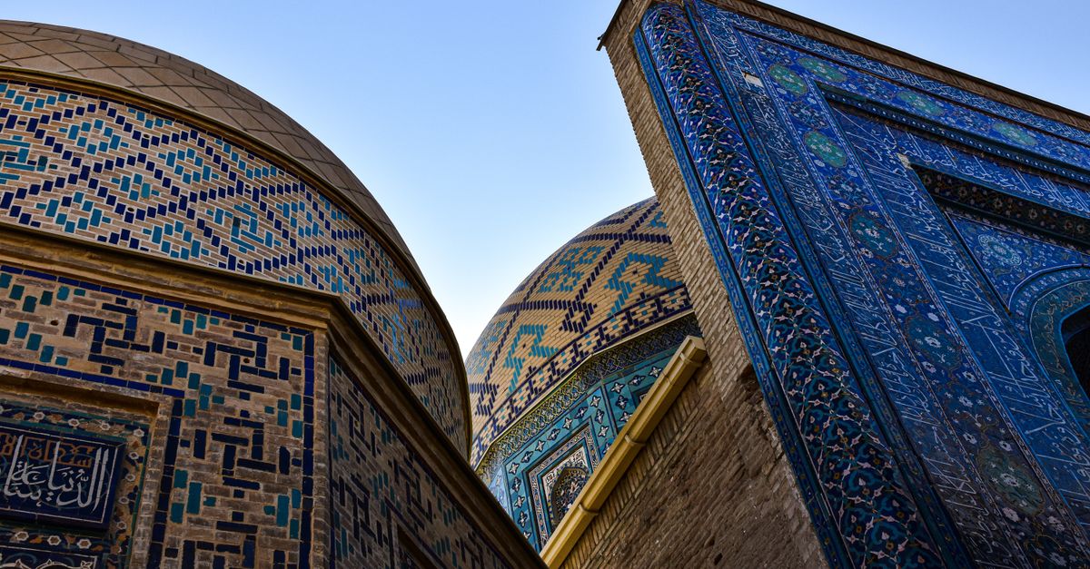 Explore the stunning mosaic patterns and domes of Shah-i-Zinda, a historic Islamic complex in Samarkand, Uzbekistan.