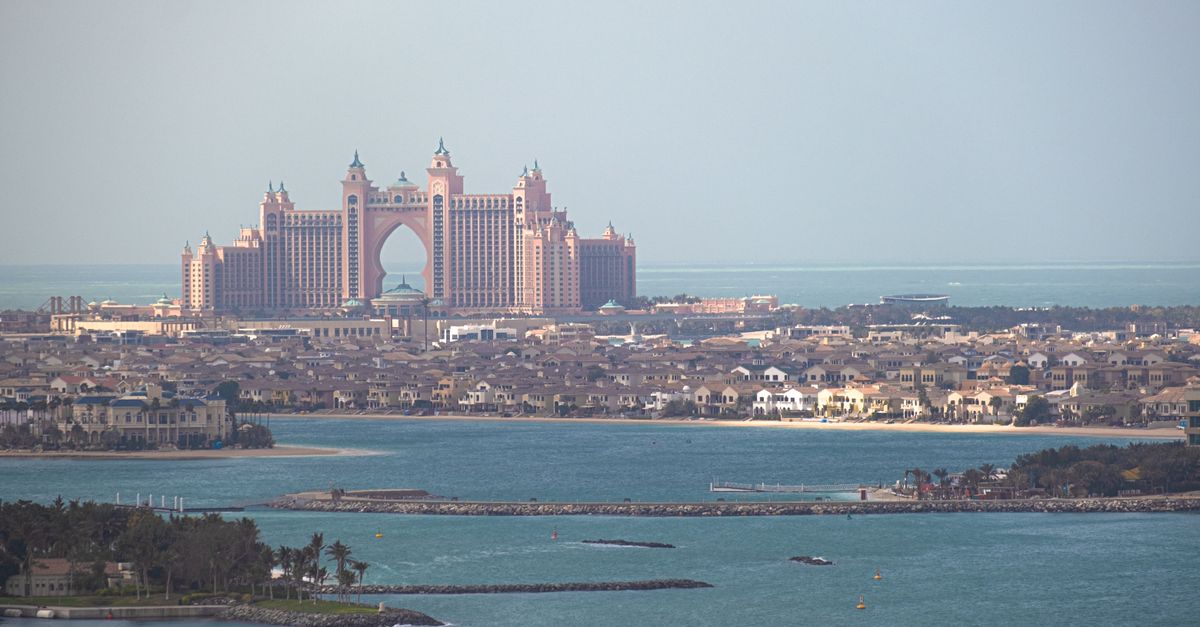 A stunning aerial view of Atlantis The Palm resort in Dubai, with the city skyline.