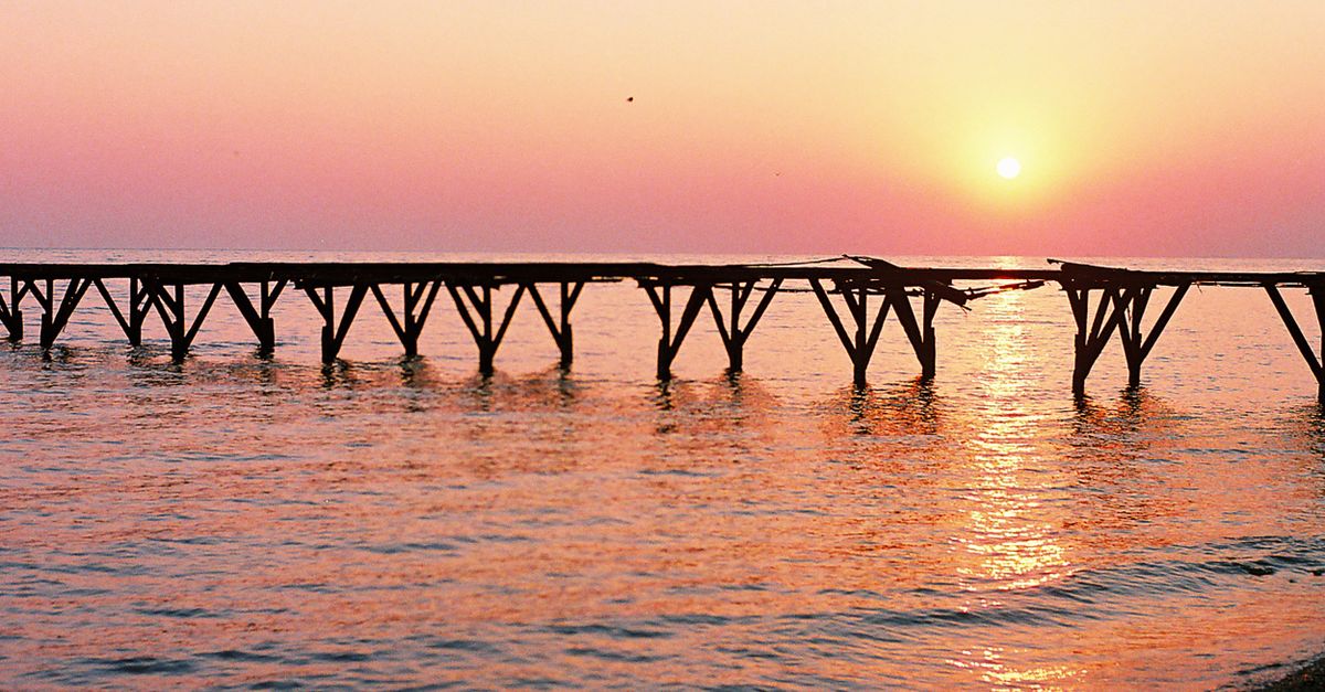Sunset view at Gelendzhik with a scenic pier extending over calm waters. Perfect nature setting.