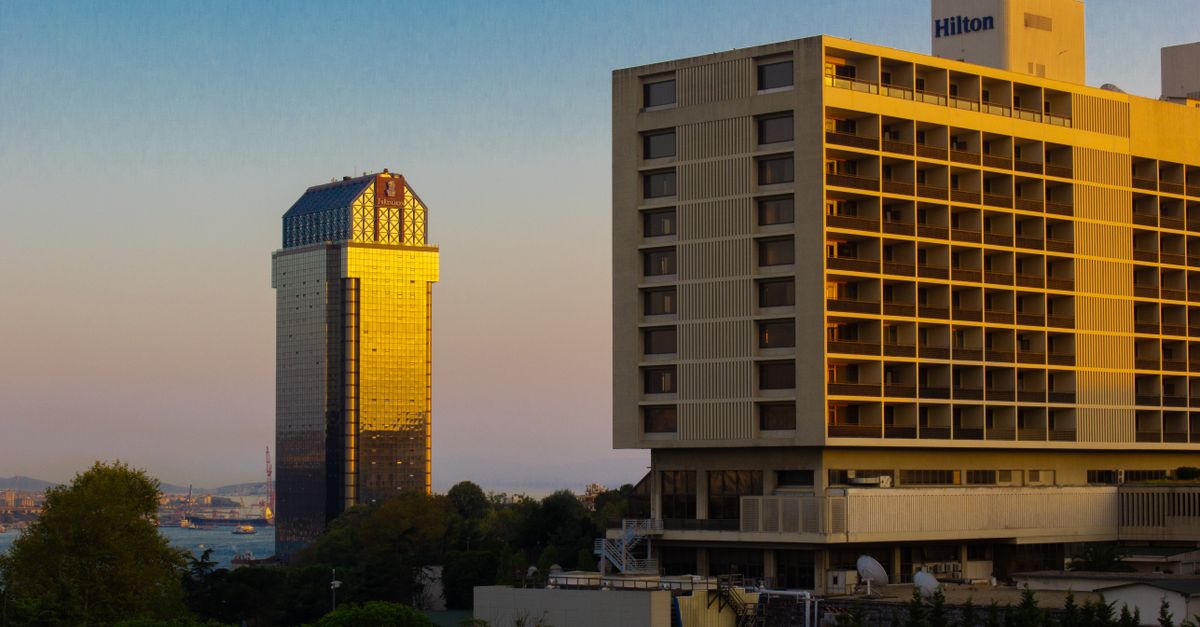 Capture of İstanbul's skyline with gleaming modern buildings at sunset.
