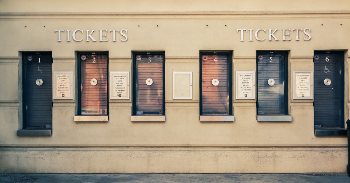 Row of closed ticket booths in Baltimore city center, showcasing urban architecture.