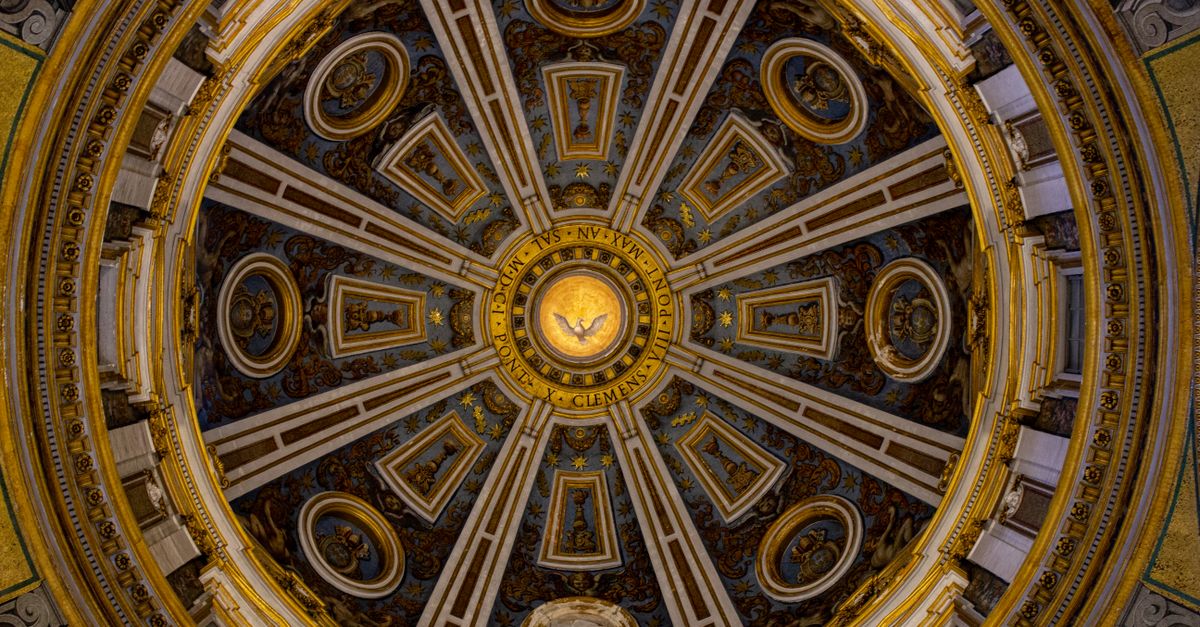 Detailed view of the ornate ceiling inside St. Peter's Basilica Dome, Vatican City.