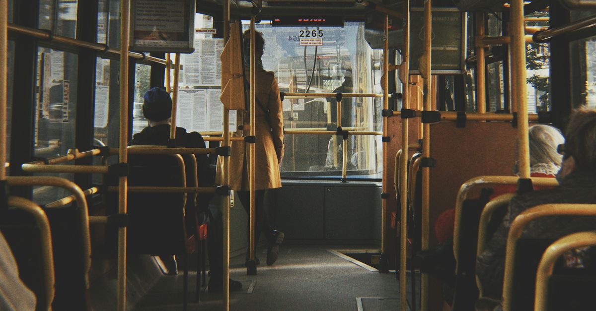 Passengers riding a city bus in Wrocław, Poland, showcasing daily public transport life.