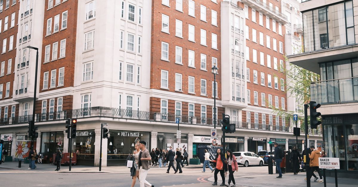 A bustling street scene at Baker Street, London, capturing urban life and architecture.