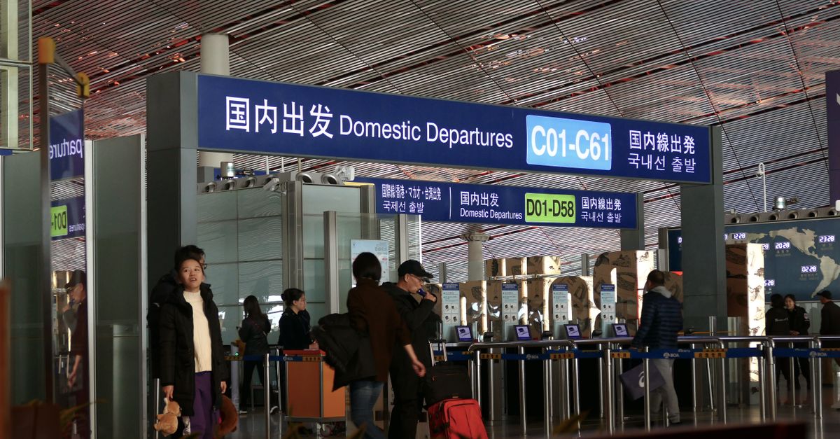 People moving through the domestic departures terminal at Beijing airport.