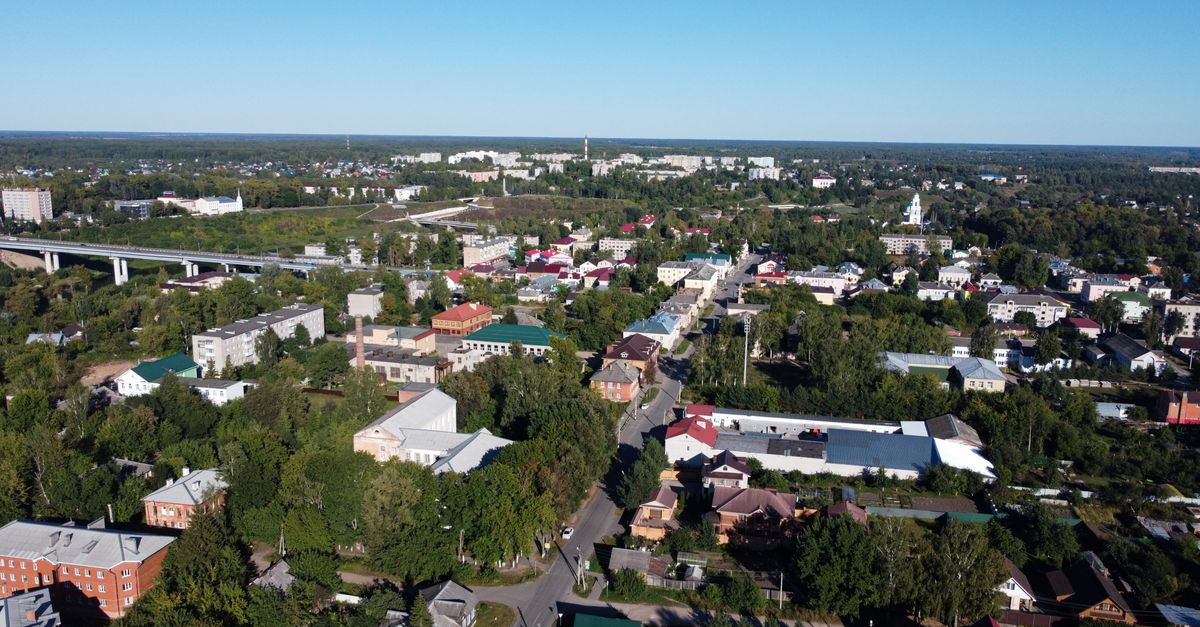 Panoramic aerial view of Rzhev city showcasing architecture, roads, and green landscapes.