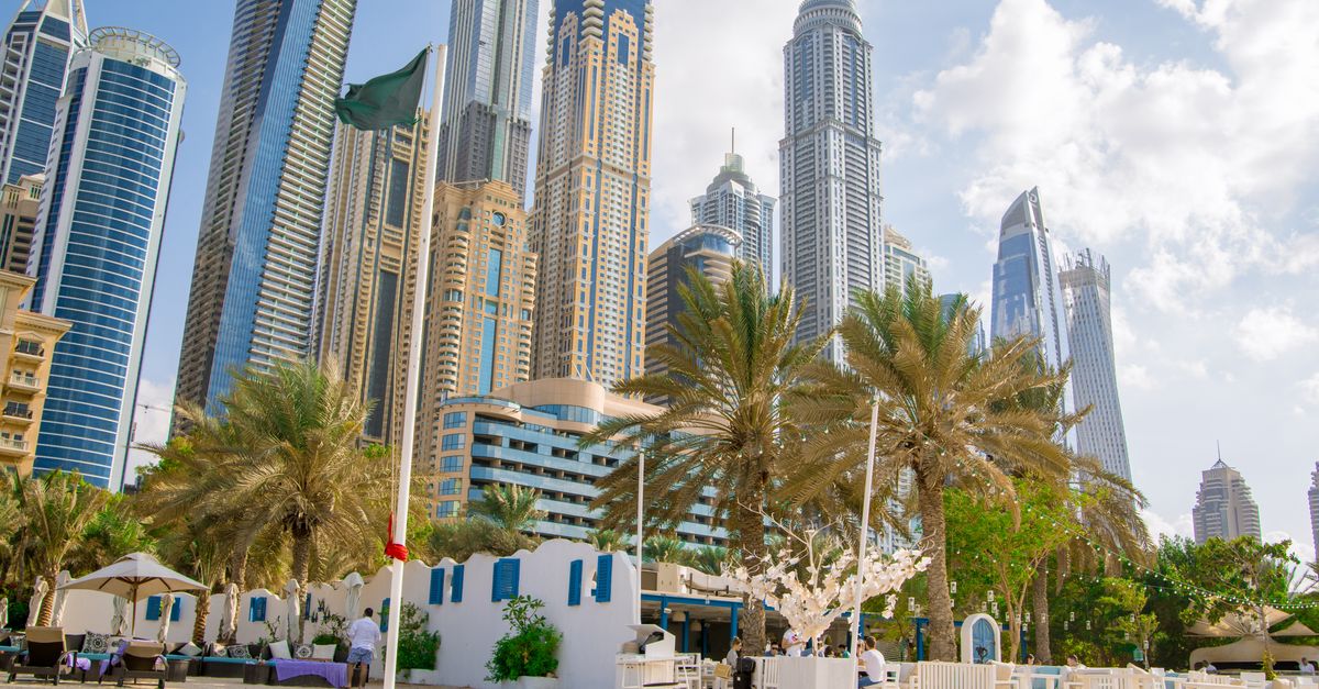 Coastal view of modern skyscrapers and beach setting in Dubai, UAE.