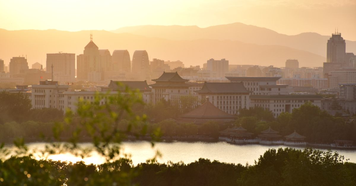 Capture of Beijing's cityscape with a serene sunset and iconic architecture.