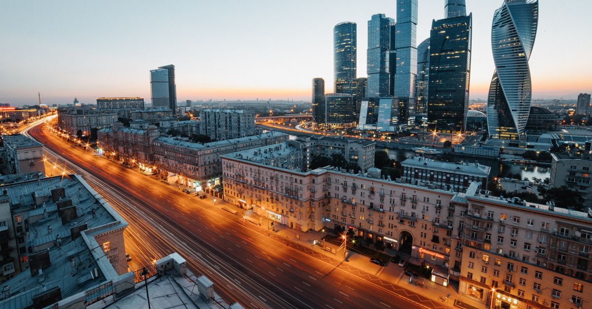 Aerial view of Moscow's skyscrapers and urban skyline during twilight, showcasing modern architecture.