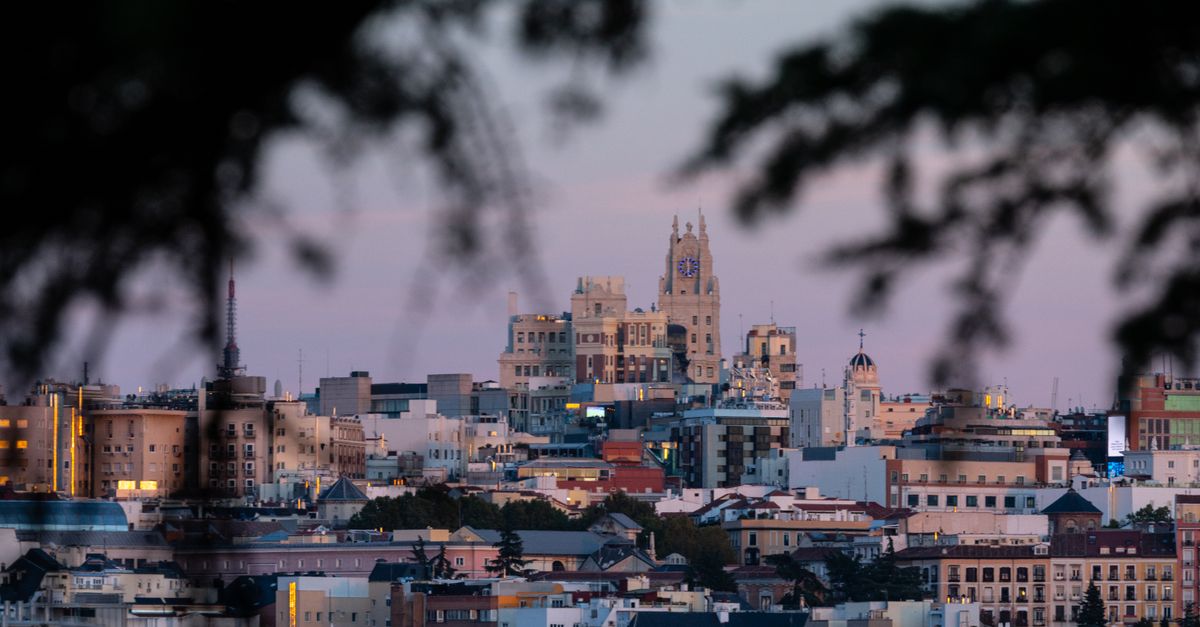 Beautiful cityscape of Madrid, Spain, captured during twilight with iconic landmarks visible.