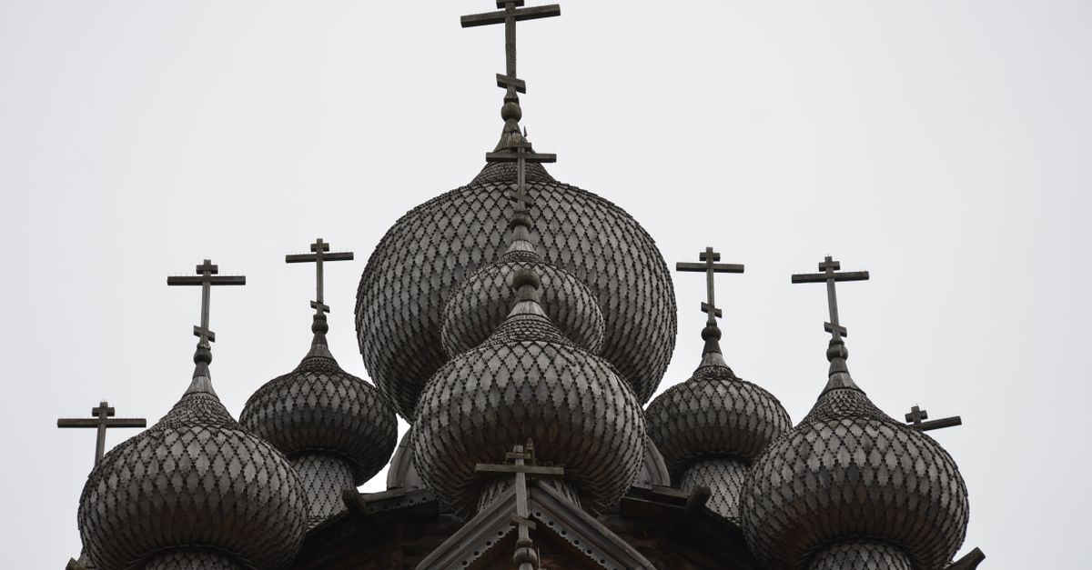 Detailed view of traditional onion-shaped domes of a Russian Orthodox Church, emphasizing architectural beauty.
