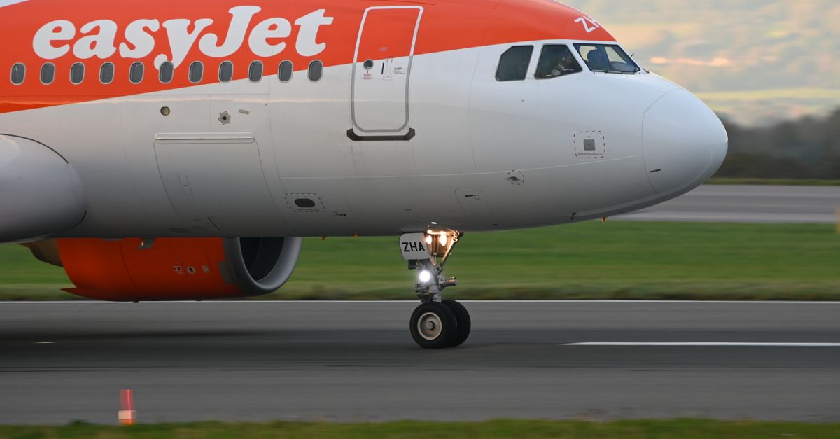 EasyJet airplane on the runway ready for departure at Bristol Airport. Side view close-up.
