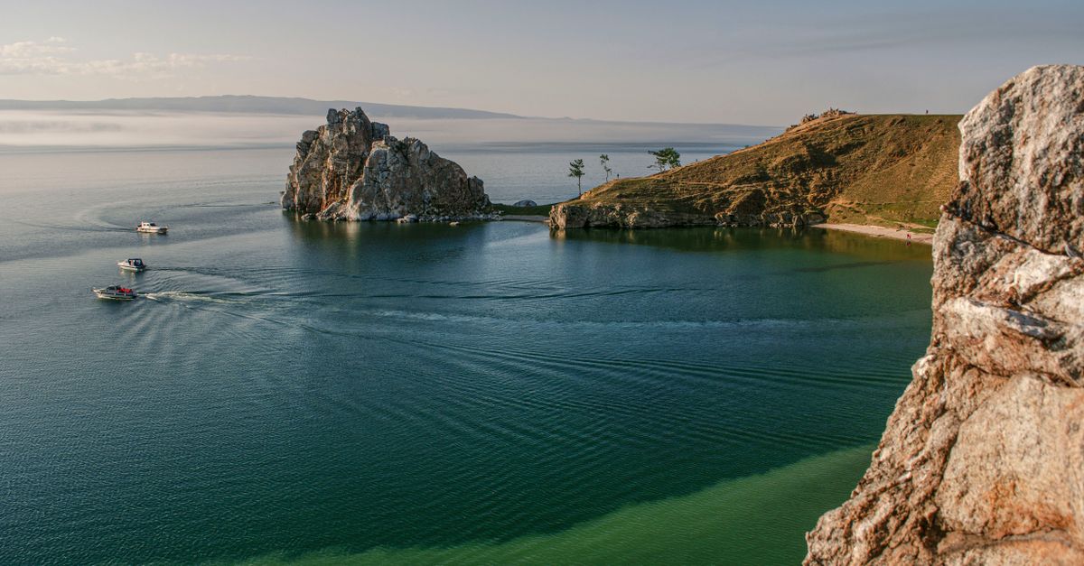 Breathtaking view of Shaman Rock on Lake Baikal, featuring serene waters and rocky cliffs.