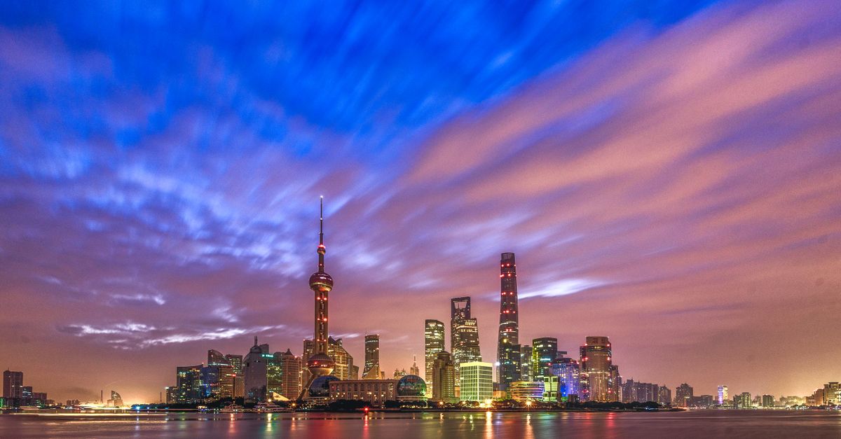 Stunning view of Shanghai skyline at twilight with vibrant skies and modern architecture.